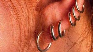 Ear with multiple piercings