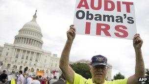 Demonstrators with the Tea Party protest the Internal Revenue Service (IRS) targeting of the Tea Party and similar groups during a rally called "Audit the IRS" outside the US Capitol in Washington, DC 19 June 2013