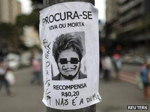 A poster with an image of Dilma Rousseff saying: "Wanted, dead or alive. Reward 0.20 reais"