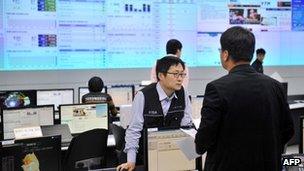 File photo: Members of the Korea Internet Security Agency check on cyber attacks at a briefing room of KISA in Seoul on 20 March 2013