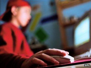 Teenage boy using computer