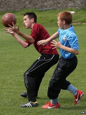 Players take part in the game to Sheffield Rules