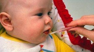 Baby receiving an oral vaccine