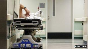 A man waits for treatment in a hospital corridor in Houston, Texas in July 2009