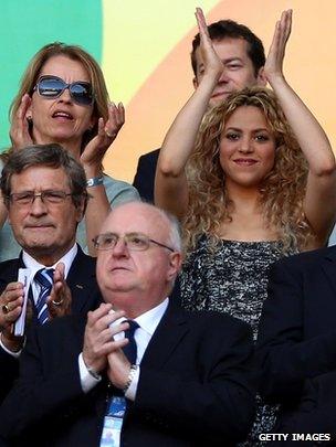 Shakira, right, applauds at the Confederations Cup match between Italy and Spain