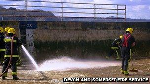 Fire crew cleans Shoalstone Pool. Pic; Devon and Somerset Fire Service