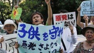 Protesters shout slogans during an anti-nuclear rally in front of the Nuclear Regulation Authority (NRA) in Tokyo, Monday, 8 July 2013