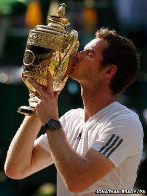 Andy Murray celebrates with the trophy