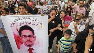 Egyptian Coptic Christians mourn for a man killed in clashes in April 2013 (24 May 2013)