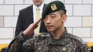 South Korean actor and singer Rain salutes to his fans and media in front of the Defense Ministry in Seoul, South Korea, 10 July 2103