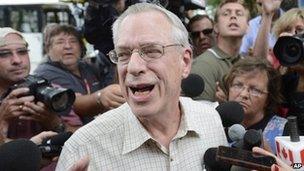 Rail World Inc President Edward Burkhardt speaks to the media as he tours Lac-Megantic, Quebec, 10 July 2013