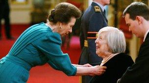 Princess Anne presents Anna Wing with an MBE