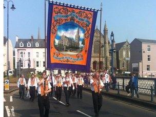 The banner is carried across Craigavon Bridge