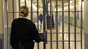 A prison guard locking a door at Wormwood Scrubs prison in west London