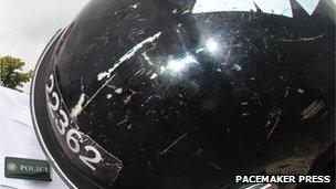 The PSNI showed damage to one officers helmet, caused by a ceremonial sword