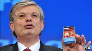 EU Commissioner Tonio Borg with cigarette pack, 19 Dec 12