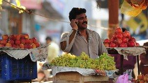 Fruit seller on the phone