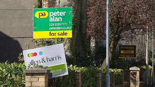 Estate agent boards outside houses in Cardiff