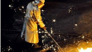 A man works at the blast furnace of the ArcelorMittal steel plant of Grande-Synthe, northern France