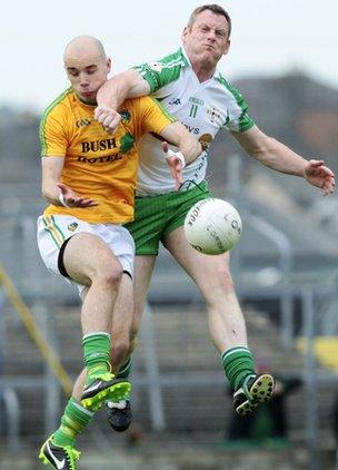 Leitrim's Robbie Lane is challenged by London forward Lorcan Mulvey