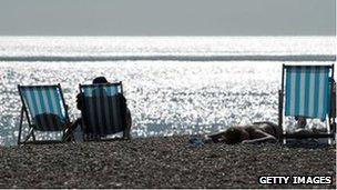 Sunbathers in Brighton on 20 July 2013