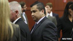 George Zimmerman leaves court with his family after the jury delivered a not guilty verdict in his trial for the 2012 shooting death of Trayvon Martin at the Seminole County Criminal Justice Center in Sanford, Florida, 13 July 2013