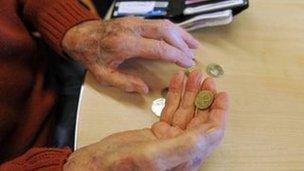 Pensioner holding change