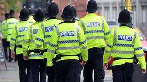 Police officers in high-visibility coats