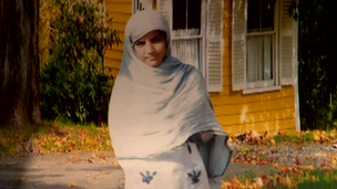 A young girl in a headscarf