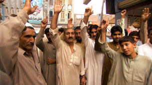 Men cheering in the street