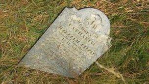 Damaged gravestone