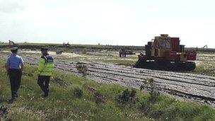 Police at Monivea turf-cutting