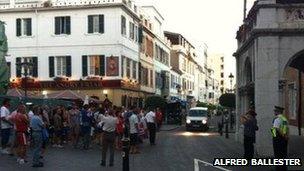 A group of protesters standing outside the governor's house in Gibraltar