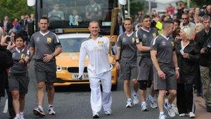 Mark Ormrod carrying the Olympic torch, 2012