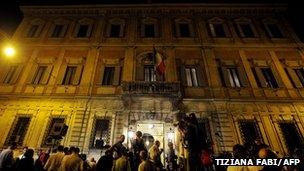 Reporters wait in front of former Italian prime minister Silvio Berlusconi's residence, Palazzo Grazioli (August 1, 2013) in Rome