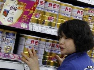 Chinese salesgirl with baby milk