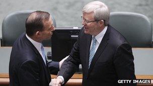 Australian PM Kevin Rudd (r) shakes hands with opposition leader Tony Abbott (l) on 27 June 2013