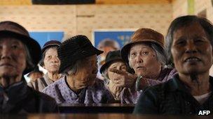 File photo: elderly women in a tea house in Chengmai city, in China's southern Hainan province, 22 January 2013