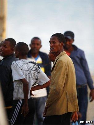 Migrants freshly arrived in at Delimara, Malta, 4 August