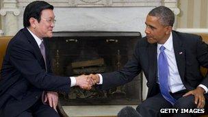 US President Barack Obama and President Truong Tan Sang of Vietnam shake hands during a meeting in the Oval Office of the White House