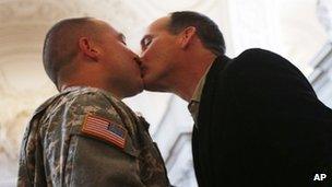 US Army Captain Michael Potoczniak (L) and Todd Saunders (R), partner of ten years exchange kisses during their wedding ceremony at City Hall in San Francisco 29 June 2013