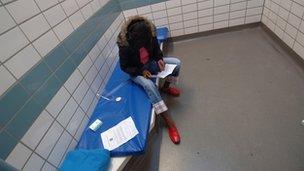 A woman in a police cell