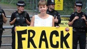 Caroline Lucas holding 'Frack Free Zone' sign at Balcombe protest