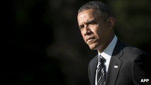 US President Barack Obama walks on the South Lawn at the White House 22 August 2013