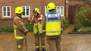 Firemen outside evacuated flats in Billericay