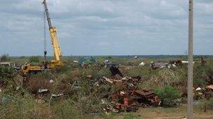 Image of equipment clearing wreckage in Mullivaikkal