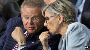 Senate Foreign Relations Chairman Sen. Robert Menendez, left, confers with committee member Sen. Barbara Boxer, on Capitol Hill in Washington, Tuesday, 3 September, 2013.