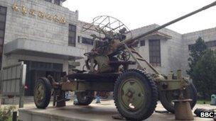 A military vehicle sits outside a museum in Dandong, China