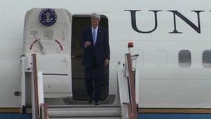 John Kerry arrives at Stansted airport