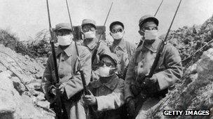 French troops wearing an early form of gas mask in the trenches during the 2nd Battle of Ypres